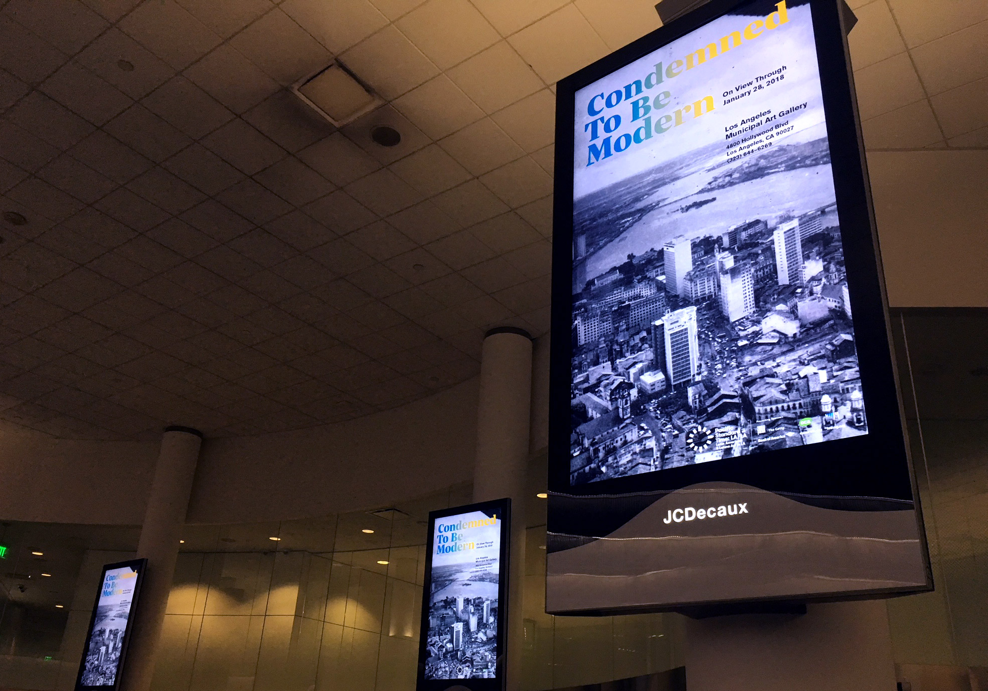 Condemned To Be Modern digital poster at LAX